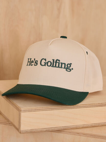 He's Golfing Trucker Hat - TULLABEE