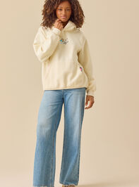 The World is Better Hoodie Detail 2 - TULLABEE