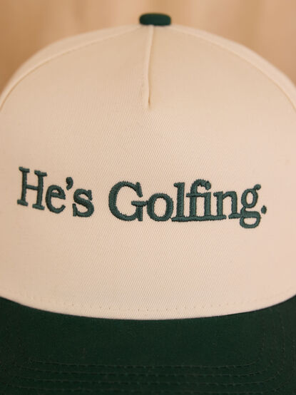 He's Golfing Trucker Hat - TULLABEE